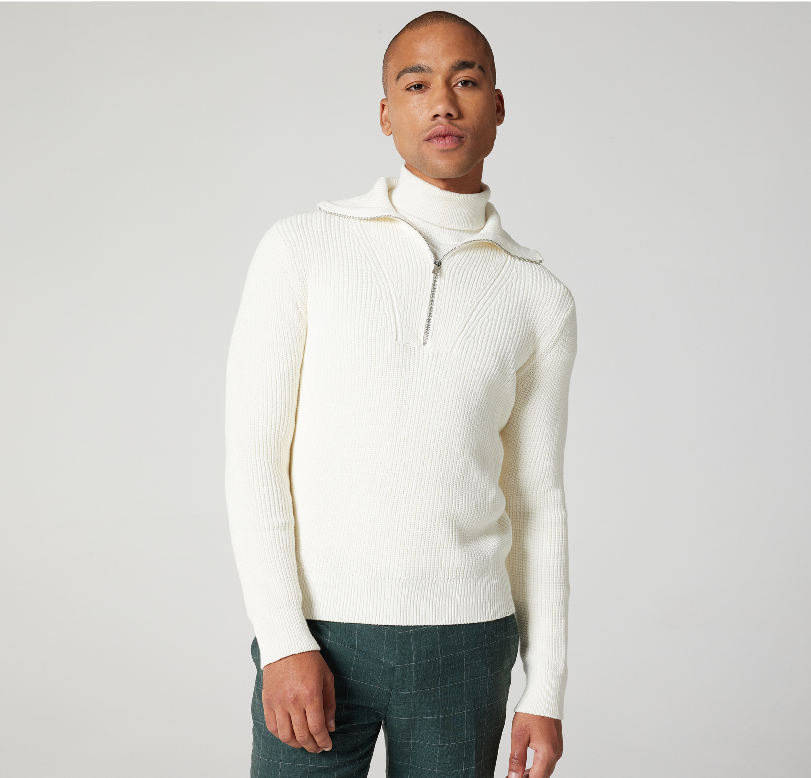 The weekend go-to Model wearing aviator funnel neck cotton sweater in cream