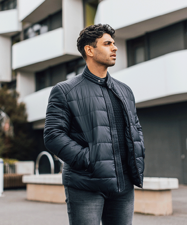 Amir Manoly in POLITIX outfit featuring the Bourdain Puffer Jacker in Navy 