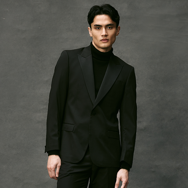 Model wearing the POLITIX SLim Stretch Tuxedo Satin Peak Lapel Tuxedo