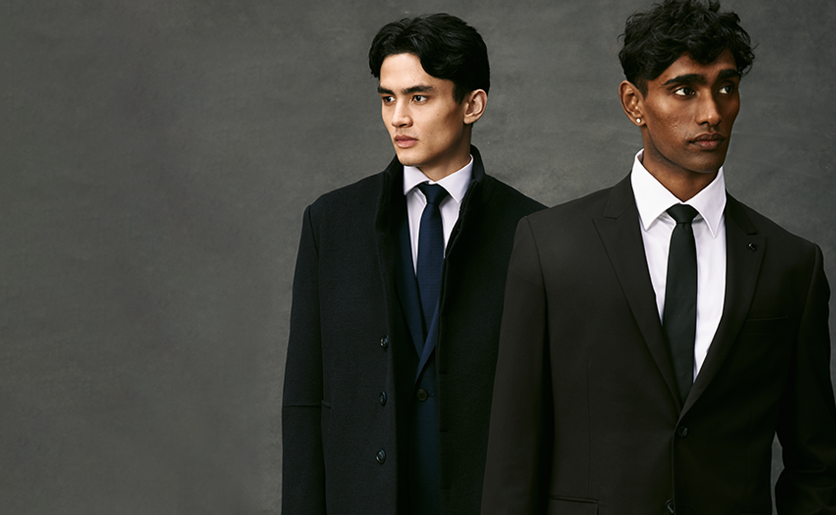 Image of two models wearing POLITIX Navy and Black Suit 