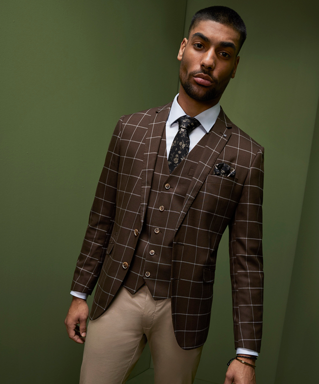 Put Your Vest Foot Forward Model wearing three piece with vest POLITIX suit Chocolate